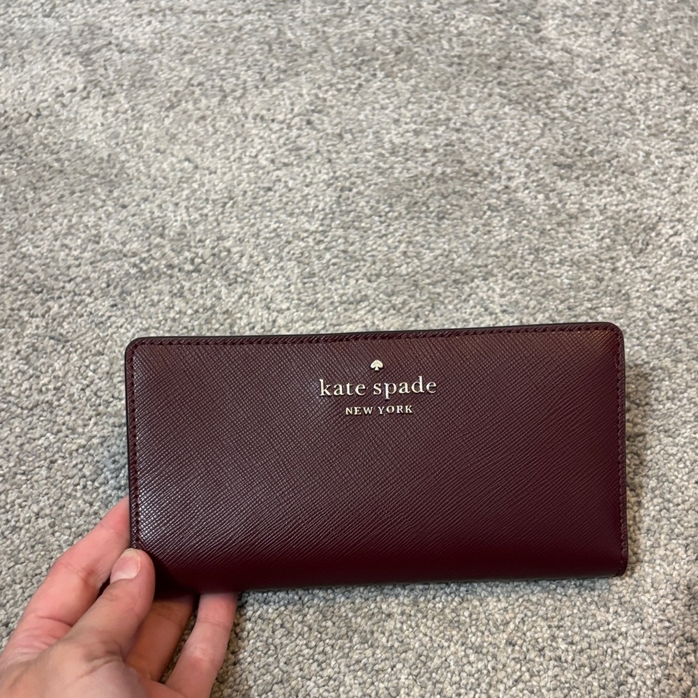 Kate Spade burgundy leather continental wallet with gold logo